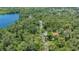 Scenic aerial view showcasing a tranquil lake surrounded by lush greenery at 7912 Estates Dr, Sarasota, FL 34243