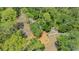 Aerial view of a playground surrounded by trees in a wooded area at 7912 Estates Dr, Sarasota, FL 34243