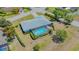 Aerial view of home showing screened pool at 7912 Estates Dr, Sarasota, FL 34243