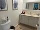 Neutral bathroom features single sink vanity and decor at 7912 Estates Dr, Sarasota, FL 34243
