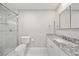 Modern bathroom featuring a glass-enclosed shower, granite countertop, and updated fixtures at 7912 Estates Dr, Sarasota, FL 34243
