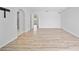 Spacious bedroom with ample natural light, en-suite bathroom access, and new, modern flooring at 7912 Estates Dr, Sarasota, FL 34243