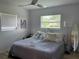 Cozy bedroom features a plush bed, ample natural light, and soothing decor at 7912 Estates Dr, Sarasota, FL 34243
