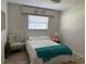 Cozy bedroom with floral accents and a comfortable bed at 7912 Estates Dr, Sarasota, FL 34243