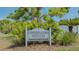 Conservatory Estates sign with lush landscaping, marking a Palm Aire deed-restricted community at 7912 Estates Dr, Sarasota, FL 34243