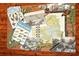 Collage with butterflies, lizards, magnifying glass and a map of local area at 7912 Estates Dr, Sarasota, FL 34243
