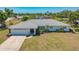 Charming single-story home with manicured lawn and attached two car garage at 7912 Estates Dr, Sarasota, FL 34243