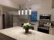Beautiful kitchen featuring white cabinetry, stainless steel appliances, and a spacious island at 7912 Estates Dr, Sarasota, FL 34243