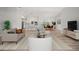 Bright and airy living room featuring an open layout, modern furnishings, and seamless flow to the pool area at 7912 Estates Dr, Sarasota, FL 34243