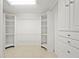 Large walk-in closet with custom shelving and ample storage space for an organized wardrobe at 7912 Estates Dr, Sarasota, FL 34243