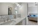 Elegant bathroom featuring dual sinks, mosaic tile backsplash, and modern lighting at 8001 20Th W Pl, Bradenton, FL 34209