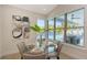 Charming breakfast nook with bright light, modern art, and views of the gorgeous outdoor pool at 8001 20Th W Pl, Bradenton, FL 34209