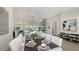 Open-concept dining area with pool views, modern decor, and seamless flow to living area at 8001 20Th W Pl, Bradenton, FL 34209