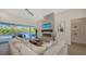 Cozy living room with fireplace and access to a pool area at 8001 20Th W Pl, Bradenton, FL 34209