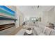 Spacious living room with modern fireplace, sleek decor, and plenty of natural light at 8001 20Th W Pl, Bradenton, FL 34209