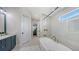 Gorgeous bathroom with standalone soaking tub, walk in shower, and entry to the main bedroom at 8001 20Th W Pl, Bradenton, FL 34209