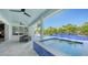 Luxurious outdoor area featuring a pool and spa with a beautiful waterfall feature and dining at 8001 20Th W Pl, Bradenton, FL 34209