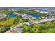 Panoramic aerial view showcases a beautiful neighborhood with tranquil lakes and picturesque landscaping, offering a serene lifestyle at 8229 Grande Shores Dr, Sarasota, FL 34240