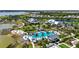 An aerial view of the community pool, clubhouse, and surrounding neighborhood at 8229 Grande Shores Dr, Sarasota, FL 34240