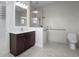 Modern bathroom featuring a glass shower, tile flooring, and sleek fixtures at 8229 Grande Shores Dr, Sarasota, FL 34240