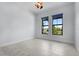 Bright bedroom with tile flooring and view to the outside at 8229 Grande Shores Dr, Sarasota, FL 34240
