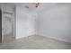 Bedroom featuring tile flooring, neutral paint, and a large closet at 8229 Grande Shores Dr, Sarasota, FL 34240