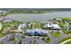 Aerial view showcases the community clubhouse, pool, and amenity center, highlighting the neighborhood's recreational facilities at 8229 Grande Shores Dr, Sarasota, FL 34240