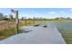 Community dock with access to a serene lake and picturesque views at 8229 Grande Shores Dr, Sarasota, FL 34240
