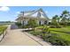Charming community center with modern architecture and lush landscaping by the water at 8229 Grande Shores Dr, Sarasota, FL 34240