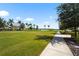 Community greenspace with sidewalks, trees, and landscaping at 8229 Grande Shores Dr, Sarasota, FL 34240