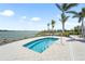 Community hot tub overlooking the lake and beautiful landscaping at 8229 Grande Shores Dr, Sarasota, FL 34240