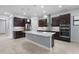 Modern kitchen with stainless steel appliances, a center island, and pendant lighting at 8229 Grande Shores Dr, Sarasota, FL 34240