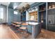Modern kitchen features bar-style seating, stainless steel appliances, and stylish decor at 8229 Grande Shores Dr, Sarasota, FL 34240