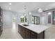 Well-appointed kitchen with a large island, modern appliances, and an open layout at 8229 Grande Shores Dr, Sarasota, FL 34240