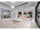 Bright living room featuring contemporary lighting, neutral tones, and an open floorplan at 8229 Grande Shores Dr, Sarasota, FL 34240