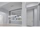 Elegant living area featuring modern lighting fixtures and neutral wall colors at 8229 Grande Shores Dr, Sarasota, FL 34240