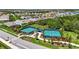 Community featuring well-maintained tennis and pickleball courts surrounded by lush landscaping and mature trees at 8229 Grande Shores Dr, Sarasota, FL 34240