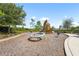 Community playground with swings, slide, and other play structures at 8229 Grande Shores Dr, Sarasota, FL 34240