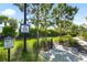 Kayak rinsing station amid lush Florida habitat with caution sign at 8229 Grande Shores Dr, Sarasota, FL 34240