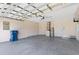 Spacious garage with modern door and plenty of room for parking and storage at 835 70Th E Dr, Sarasota, FL 34243