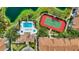 Aerial view highlighting the community pool, tennis court, and well-maintained landscaping at 850 S Tamiami Trl # 624, Sarasota, FL 34236