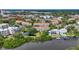Aerial view of building surrounded by lush landscaping, with a water view at 850 S Tamiami Trl # 624, Sarasota, FL 34236