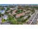 Aerial view displaying lush community landscaping, pool, and easy access to nearby roads at 850 S Tamiami Trl # 624, Sarasota, FL 34236
