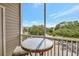 Private balcony with a glass table and seating offers an outdoor space with views at 850 S Tamiami Trl # 624, Sarasota, FL 34236