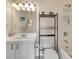 Well-lit bathroom with a single sink vanity, a large mirror, and a shower-tub combination at 850 S Tamiami Trl # 624, Sarasota, FL 34236