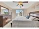 Bright bedroom with a large window, ceiling fan and traditional furnishings at 850 S Tamiami Trl # 624, Sarasota, FL 34236
