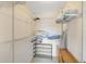 Organized closet with metal shelving and storage for clothes, shoes, and linens at 850 S Tamiami Trl # 624, Sarasota, FL 34236