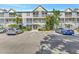 Exterior view of a multi-story building with parking, showcasing the building's facade at 850 S Tamiami Trl # 624, Sarasota, FL 34236