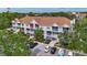 Condo exterior with balconies, parking, and lush greenery around the building at 850 S Tamiami Trl # 624, Sarasota, FL 34236