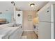 Kitchen with white appliances and cabinets and neutral countertops at 850 S Tamiami Trl # 624, Sarasota, FL 34236